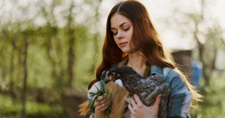 Woman holding chicken