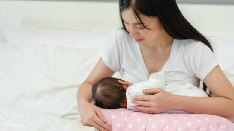 Mother breastfeeding baby