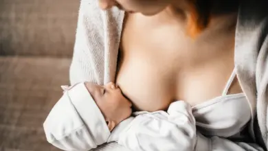 Mother breastfeeding baby